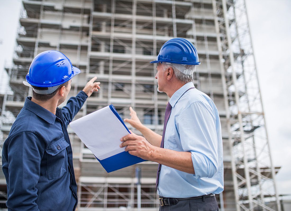 Insurance by Industry - Architect Explaining What Work to Do to With the Site Manager