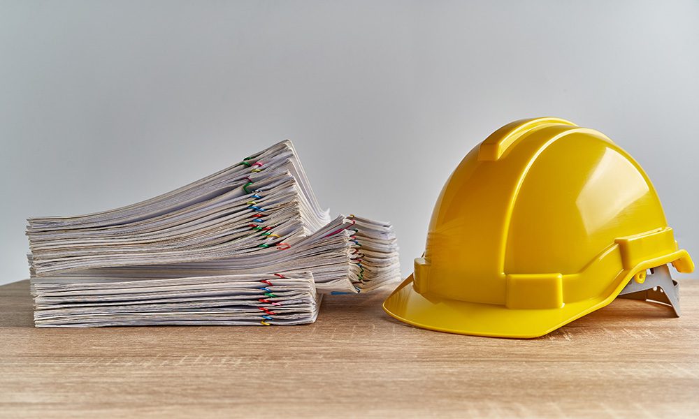 Blog - Yellow Hard Hat and Documents