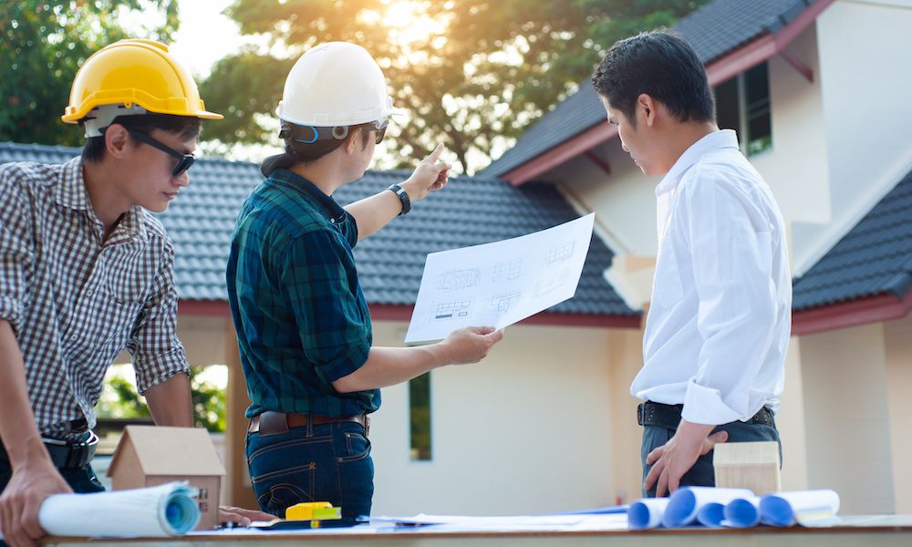 The Importance of Waiver of Subrogation for Property Managers, Building Owners, and Co-ops When Hiring Contractors in New York - Contractors and Project Manager discussing plans