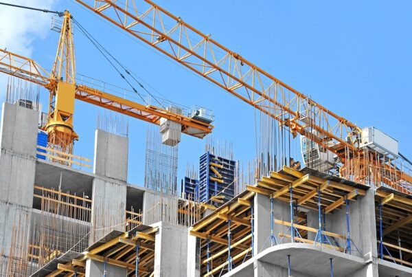 Understanding Construction Performance and Payment Bonds/ Essential Safeguards for a Successful Project - Cranes on a construction site
